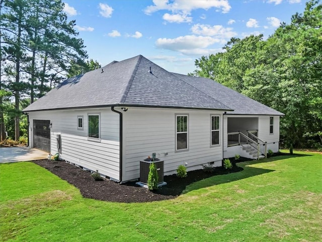 711 Concord Rd, Anderson, SC 29621 - view of side of property featuring roof with shingles, a garage, a lawn, and driveway