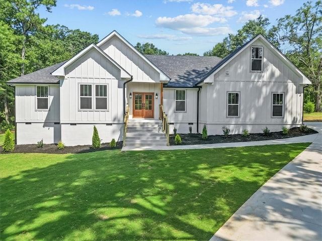 711 Concord Rd, Anderson, SC 29621 - modern farmhouse style home featuring french doors, board and batten siding, a front lawn, and a shingled roof