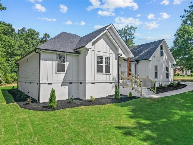 711 Concord Rd, Anderson, SC 29621 - view of property exterior featuring board and batten siding, a yard, and roof with shingles