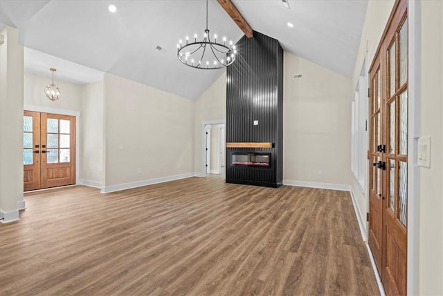 711 Concord Rd, Anderson, SC 29621 - unfurnished living room featuring french doors, a chandelier, wood finished floors, high vaulted ceiling, and beamed ceiling