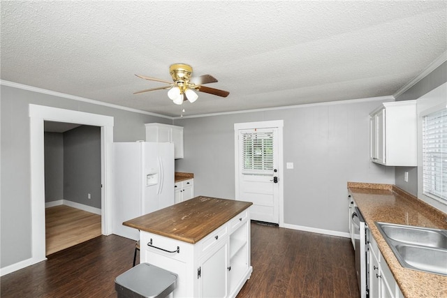 200 Maplecroft St, Liberty, SC 29657 - kitchen featuring a ceiling fan, dark wood-style floors, crown molding, white cabinetry, and a textured ceiling