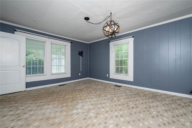 200 Maplecroft St, Liberty, SC 29657 - empty room with a chandelier, crown molding, a textured ceiling, and carpet floors