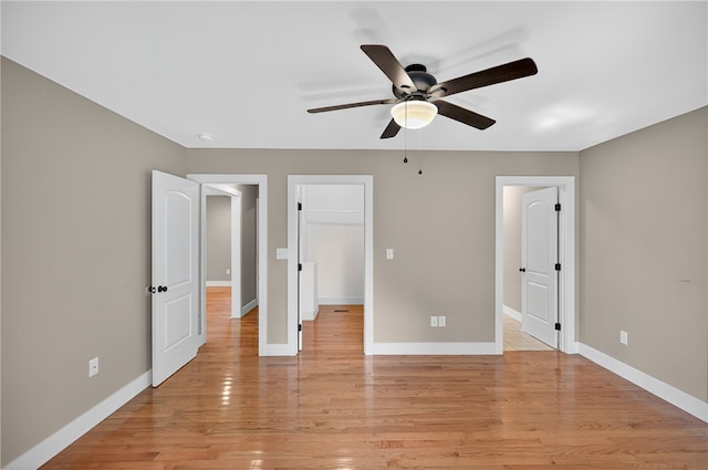 323 Indian Trl, Salem, SC 29676 - unfurnished bedroom with light wood finished floors, a walk in closet, and ceiling fan