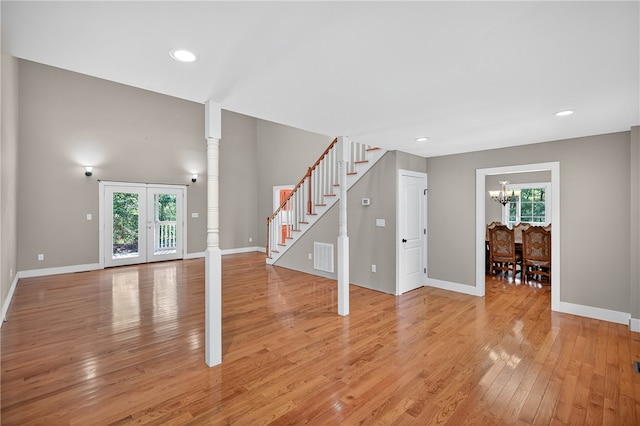 323 Indian Trl, Salem, SC 29676 - unfurnished living room featuring a chandelier, stairway, light wood-style flooring, and recessed lighting