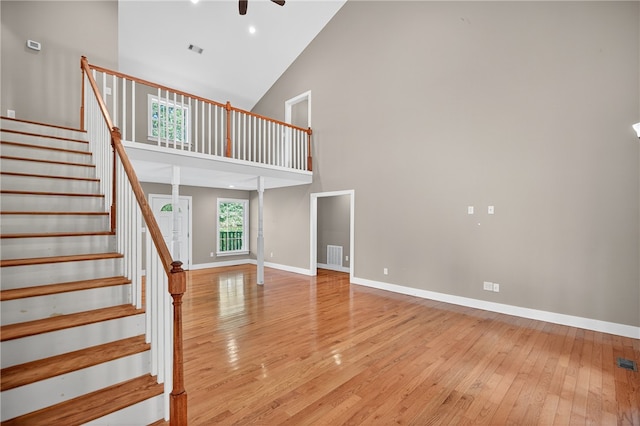 323 Indian Trl, Salem, SC 29676 - unfurnished living room featuring light wood-style flooring, high vaulted ceiling, stairway, and a ceiling fan