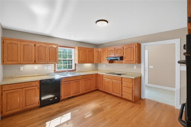 323 Indian Trl, Salem, SC 29676 - kitchen with black dishwasher, under cabinet range hood, light countertops, and light wood-type flooring