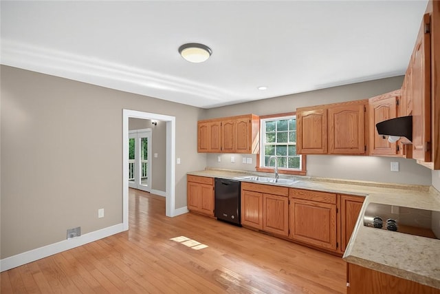 323 Indian Trl, Salem, SC 29676 - kitchen featuring black appliances, range hood, light countertops, light wood finished floors, and brown cabinets