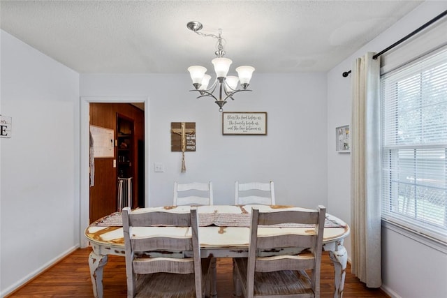 123 Radisson Rd, Seneca, SC 29678 - dining space featuring a chandelier, wood finished floors, and a textured ceiling