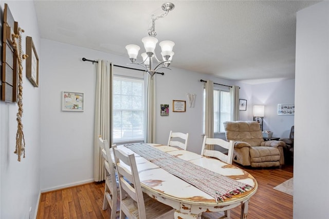 123 Radisson Rd, Seneca, SC 29678 - dining room featuring a chandelier and wood finished floors
