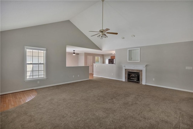 208 Playground Rd, Walhalla, SC 29691 - unfurnished living room featuring ceiling fan, carpet flooring, high vaulted ceiling, and a tiled fireplace