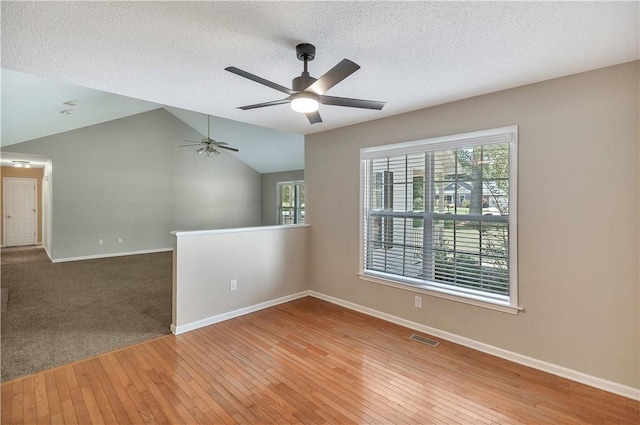208 Playground Rd, Walhalla, SC 29691 - unfurnished room featuring wood-type flooring, a ceiling fan, vaulted ceiling, and a textured ceiling