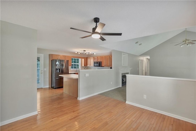 208 Playground Rd, Walhalla, SC 29691 - kitchen featuring stainless steel fridge with ice dispenser, a ceiling fan, open floor plan, light wood finished floors, and light countertops