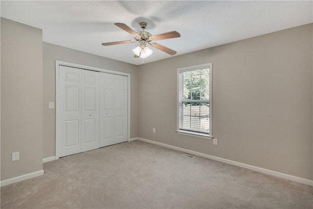 208 Playground Rd, Walhalla, SC 29691 - unfurnished bedroom featuring light colored carpet, a closet, and a ceiling fan