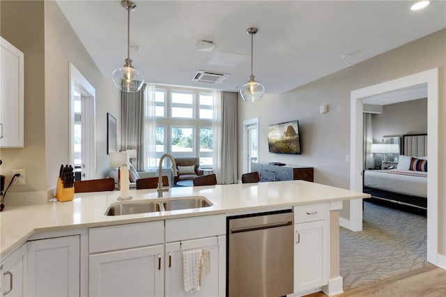 13500 Clemson Blvd Unit 1201Ab, Seneca, SC 29678 - kitchen featuring open floor plan, stainless steel dishwasher, a peninsula, and white cabinetry