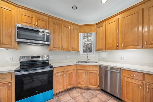 168 Wilderness Pt, Hartwell, GA 30643 - kitchen featuring appliances with stainless steel finishes, light countertops, and brown cabinets