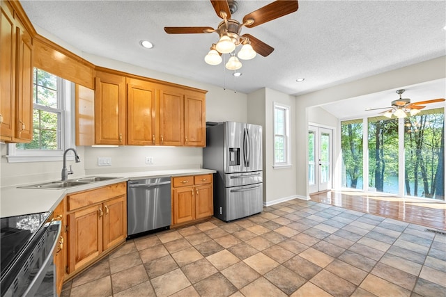 168 Wilderness Pt, Hartwell, GA 30643 - kitchen featuring appliances with stainless steel finishes, a ceiling fan, light countertops, a textured ceiling, and recessed lighting