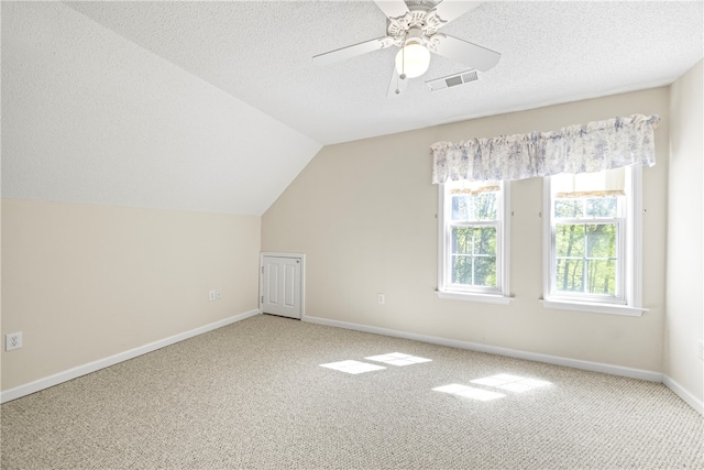 168 Wilderness Pt, Hartwell, GA 30643 - additional living space featuring carpet, a ceiling fan, a textured ceiling, and lofted ceiling
