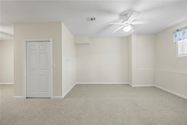 168 Wilderness Pt, Hartwell, GA 30643 - unfurnished bedroom featuring carpet floors, a textured ceiling, and a ceiling fan