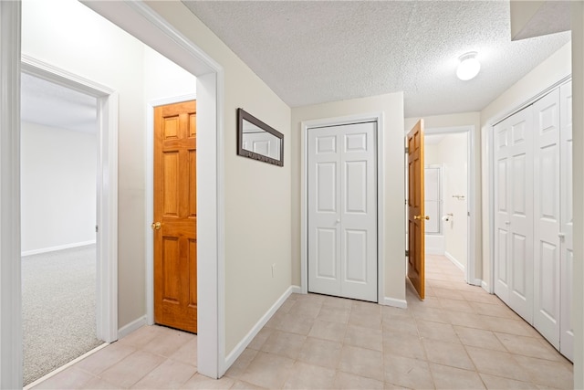 168 Wilderness Pt, Hartwell, GA 30643 - corridor with light tile patterned flooring and a textured ceiling