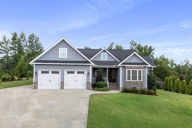 340 Fiddlers Way, Seneca, SC 29678 - craftsman inspired home with covered porch, driveway, a front lawn, a garage, and stone siding