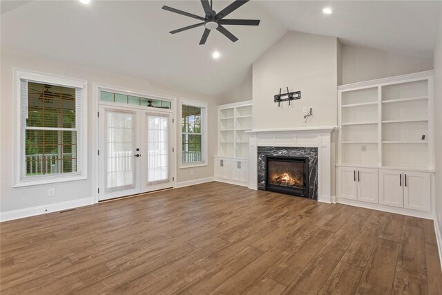 340 Fiddlers Way, Seneca, SC 29678 - unfurnished living room featuring ceiling fan, a premium fireplace, wood finished floors, high vaulted ceiling, and french doors