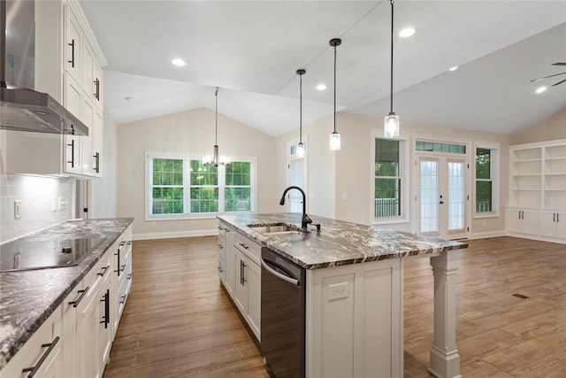 340 Fiddlers Way, Seneca, SC 29678 - kitchen featuring wall chimney range hood, stainless steel dishwasher, lofted ceiling, black electric cooktop, and wood finished floors