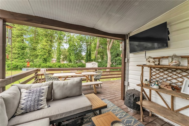 423 Lebanon Rd, Pendleton, SC 29670 - wooden terrace with a storage unit, outdoor dining space, view of scattered trees, and outdoor lounge area