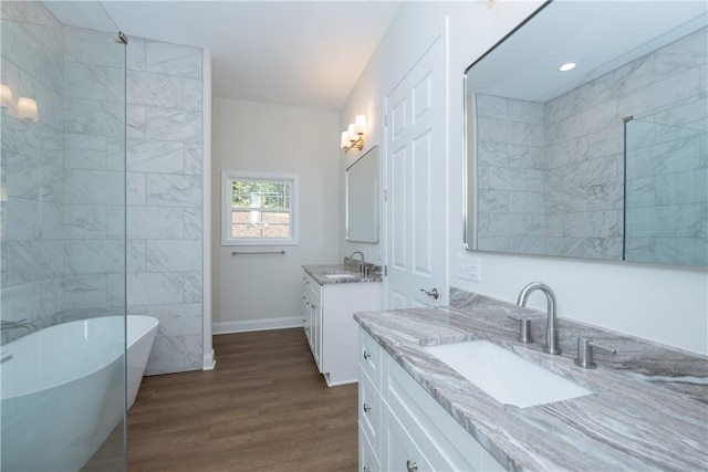 218 W Halfway Branch Rd, Walhalla, SC 29691 - bathroom with a freestanding bath, two vanities, and wood finished floors