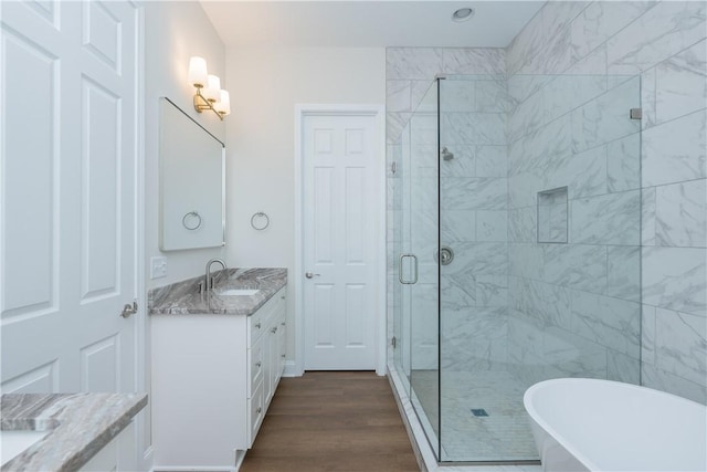 218 W Halfway Branch Rd, Walhalla, SC 29691 - bathroom featuring vanity, a stall shower, a freestanding tub, and wood finished floors