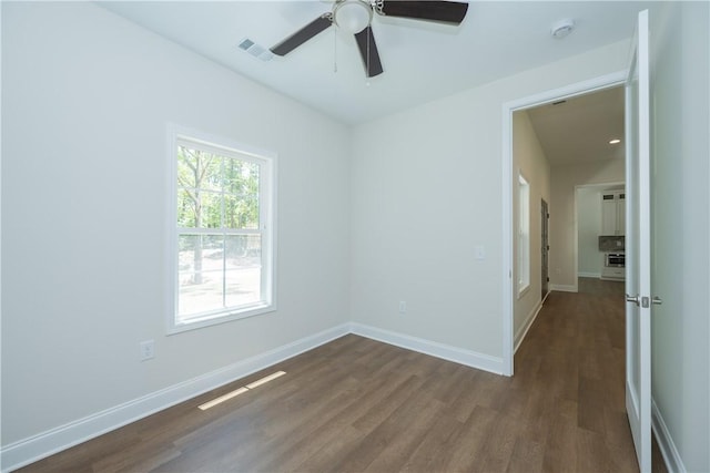 218 W Halfway Branch Rd, Walhalla, SC 29691 - spare room featuring dark wood-type flooring, a smoke detector, and a ceiling fan