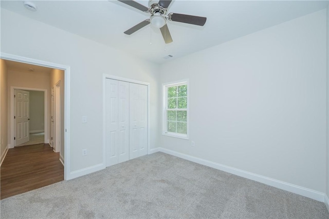 218 W Halfway Branch Rd, Walhalla, SC 29691 - unfurnished bedroom with carpet flooring, a closet, and a ceiling fan