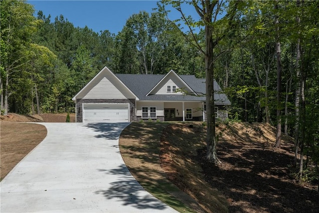 218 W Halfway Branch Rd, Walhalla, SC 29691 - view of front facade with driveway, an attached garage, and a forest view