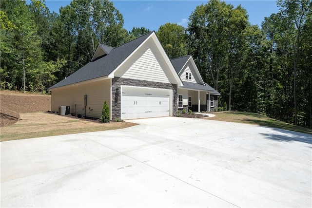 218 W Halfway Branch Rd, Walhalla, SC 29691 - view of side of home with stone siding, driveway, an attached garage, and a lawn