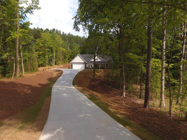 218 W Halfway Branch Rd, Walhalla, SC 29691 - view of front of property featuring concrete driveway, a view of trees, and a garage