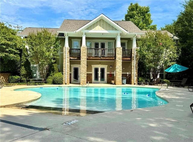 726 Lookover Dr Unit 726, Anderson, SC 29621 - back of property with french doors, a balcony, stone siding, board and batten siding, and a patio area