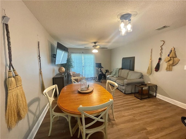 726 Lookover Dr Unit 726, Anderson, SC 29621 - dining room with ceiling fan, a textured ceiling, and wood finished floors