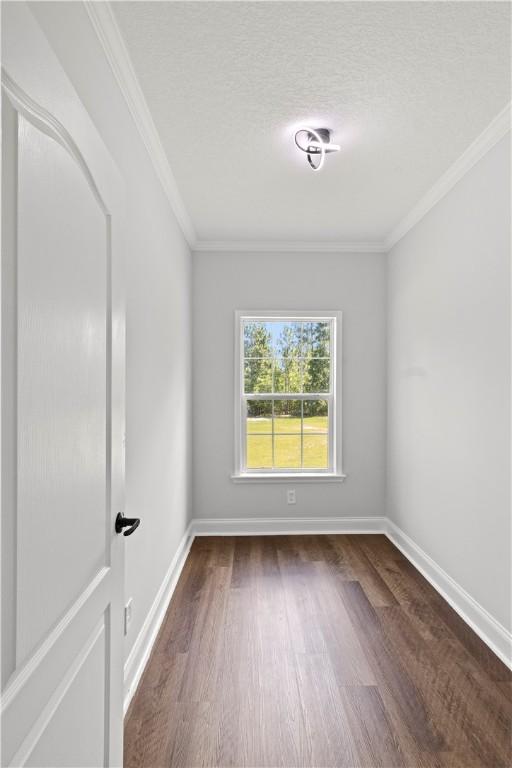 973 Pine Plain Rd, Gaston, SC 29053 - spare room with wood finished floors, crown molding, and a textured ceiling