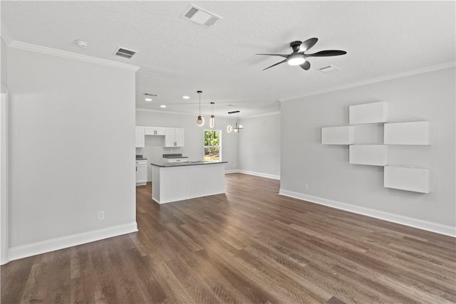 973 Pine Plain Rd, Gaston, SC 29053 - unfurnished living room featuring ornamental molding, a ceiling fan, dark wood finished floors, recessed lighting, and a chandelier