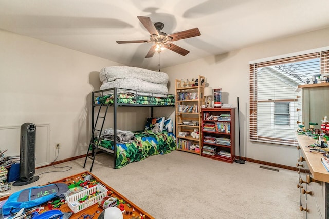 carpeted bedroom featuring ceiling fan