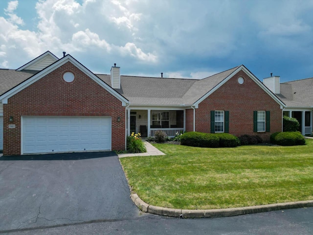 5901 Hickory Brook Way, Columbus, OH 43213 - view of front of property with a chimney, brick siding, a porch, and a front yard