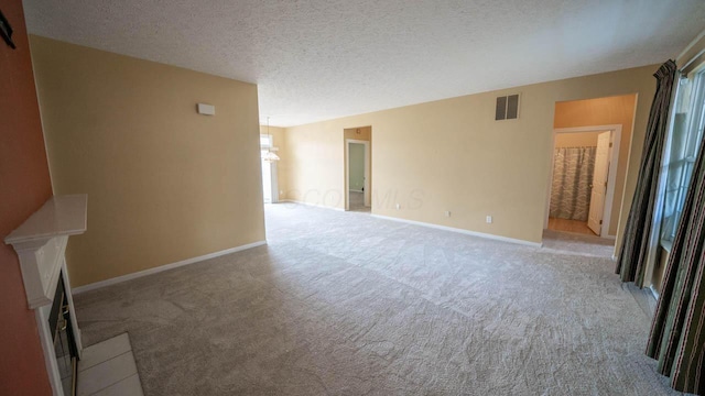 5901 Hickory Brook Way, Columbus, OH 43213 - unfurnished living room with carpet flooring, a fireplace, and a textured ceiling
