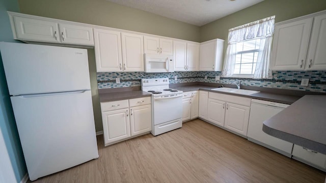 5901 Hickory Brook Way, Columbus, OH 43213 - kitchen with white appliances, dark countertops, light wood-style flooring, and white cabinets
