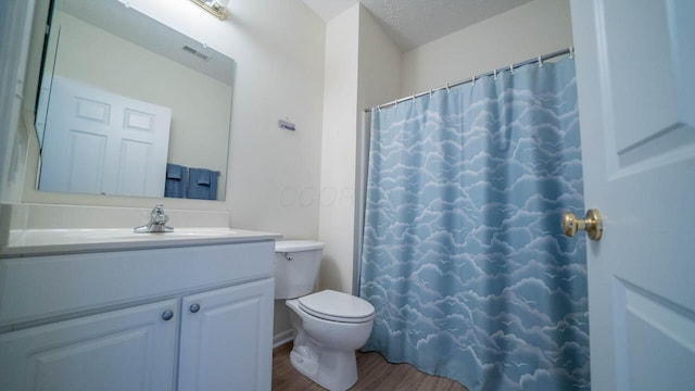 5901 Hickory Brook Way, Columbus, OH 43213 - full bath featuring vanity, wood finished floors, curtained shower, and a textured ceiling