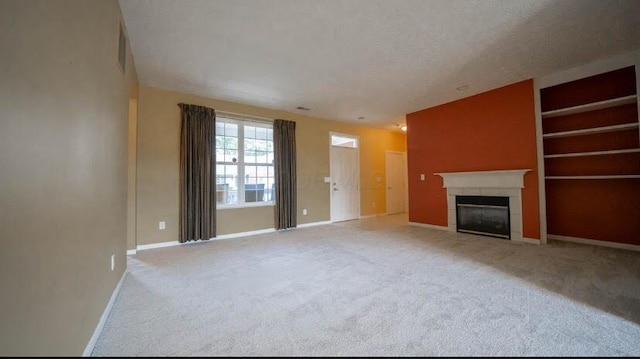 5901 Hickory Brook Way, Columbus, OH 43213 - unfurnished living room with a fireplace, carpet floors, and built in shelves