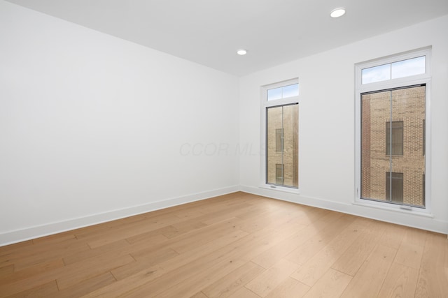 unfurnished room featuring light wood-type flooring