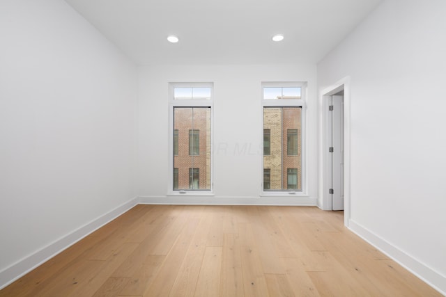 empty room with light wood-type flooring