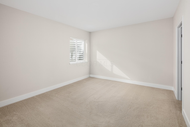 unfurnished room featuring carpet flooring