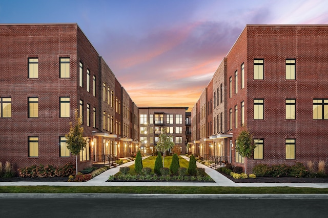 view of outdoor building at dusk