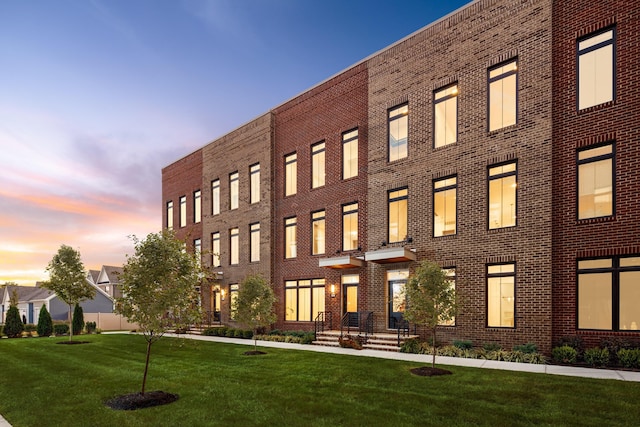 view of outdoor building at dusk