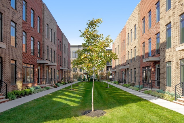 view of home's community with a yard